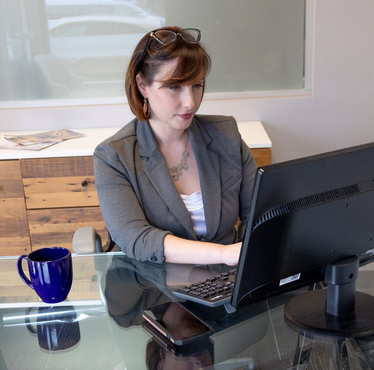 Realtor Beth Little working at a computer