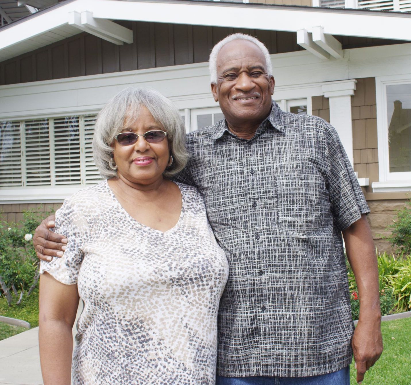 senior adult couple downsizing home by packing boxes
